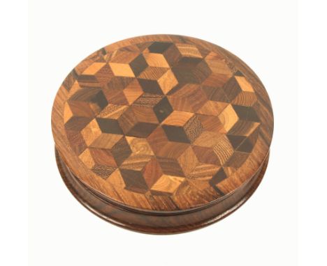A Tunbridge ware rosewood circular table snuff box, the slightly domed lid with a full panel of cube work, 9.7cm diameter.(Fr