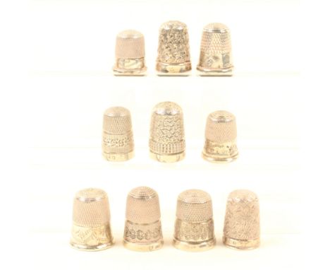 Ten English silver thimbles, most with decorative borders, all hallmarked. (10)