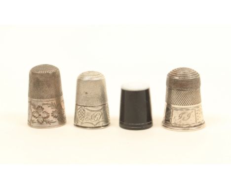 Four thimbles, comprising; a horn example with pearl top, and three early 19th century silver thimbles, all initialled and wi