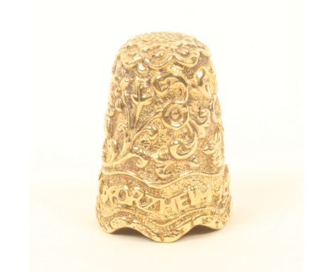 A silver gilt thimble in the Indian style, with a band inscribed 'Schmuckmuseum, Pforzheim 1978', over an undulating rim, int