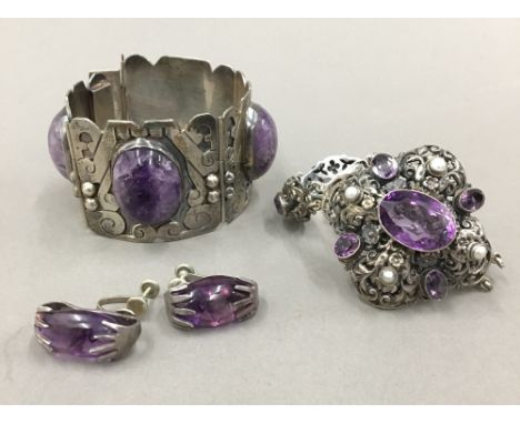 A Mexican silver mineral set bangle and earrings, together with an amethyst set silver bracelet