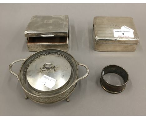 Two silver cigarette boxes, a silver and glass dish and a napkin ring