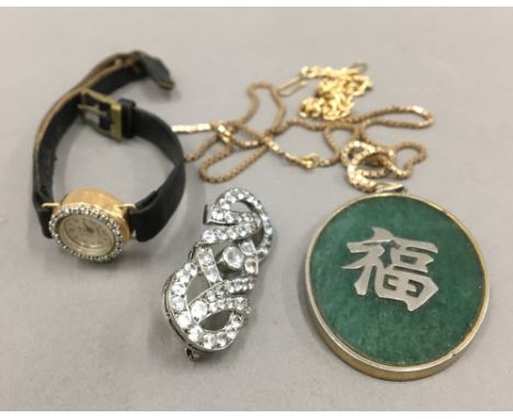 A gold cased diamond set lady's Lacorda wristwatch, together with a jade pendant on a 10 K gold chain and a paste set brooch