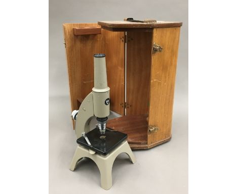 A vintage cased microscope