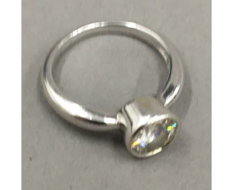 A 14 K white gold solitaire ring