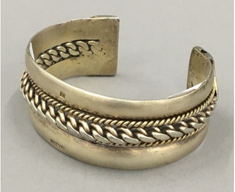 An Egyptian silver bangle