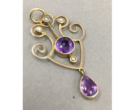 An Edwardian 9 ct rose gold amethyst and seed pearl La Vella drop pendant
