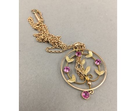 An Edwardian 9 ct gold amethyst set pendant on a 9 ct gold chain (4 grammes total weight) 