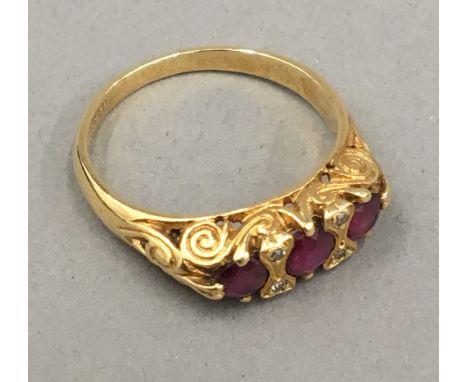 An 18 ct gold ruby and diamond set ring, size P (5 grammes total weight) 