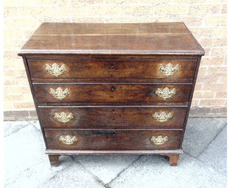 AN OAK CHEST OF FOUR LONG GRADUATED DRAWERS  on bracket feet, 92cm wide 46cm deep 89cm high