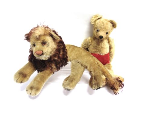 A PALE GOLD MOHAIR TEDDY BEAR  with clear glass eyes and a black vertically stitched nose, on a jointed body with soft cotton