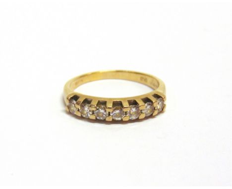 A DIAMOND HALF-ETERNITY RING the seven round brilliants approx. 0.42cts total, claw set to a 'D' section shank, stamped '18Kt