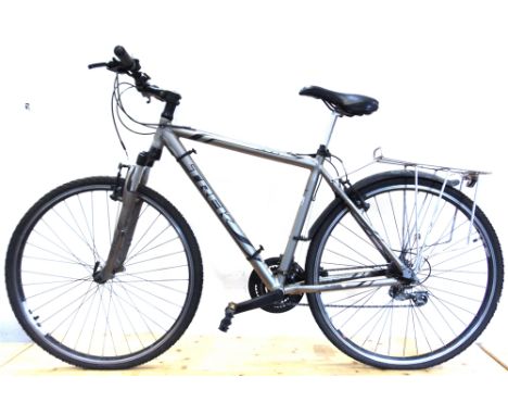A TREK 2100 GENTLEMAN'S HYBRID CITY CRUISER BICYCLE  the 51cm frame in silver, with straight handlebars, front fork shock abs