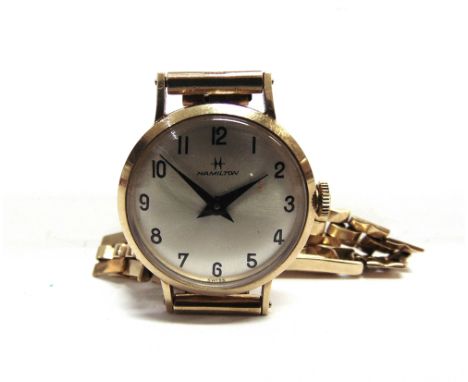 HAMILTON, A LADY'S 9CT GOLD ROUND BRACELET WATCH circa 1972, the brushed silvered dial with black painted Arabic numerals and