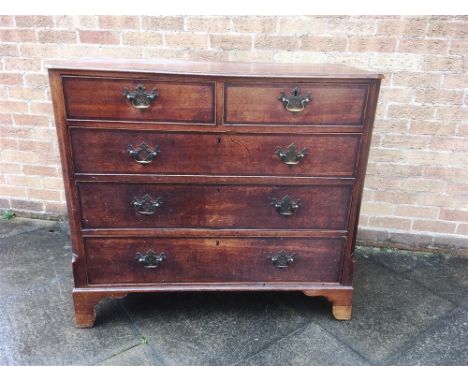 A 19TH CENTURY OAK CHEST OF TWO SHORT AND THREE LONG DRAWERS  with mahogany crossbanded decoration, on bracket feet, 113cm wi