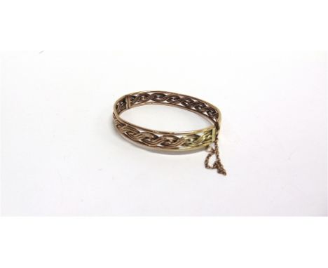 AN EARLY 20TH CENTURY ROSE GOLD HOLLOW WOVEN-WIRE HINGED BANGLE  in Celtic style, on a push snap, stamped '9ct', approx. 9.5m