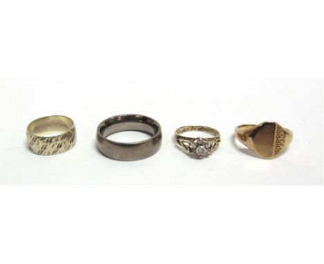 A GROUP OF FOUR RINGS comprising; a modern 9ct gold part-textured oval signet ring, Sheffield 1977, size X, 7.5g; a 9ct gold 