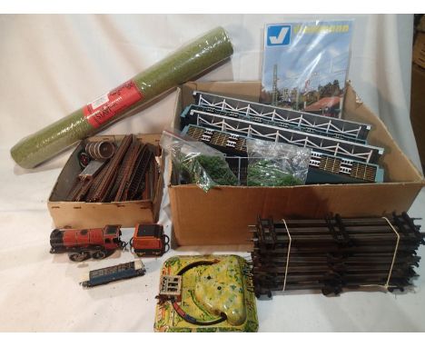 Unboxed Viessmann train station, Hornby O gauge clockwork loco, Lima N gauge diesel engine and some trackside. Items appear i