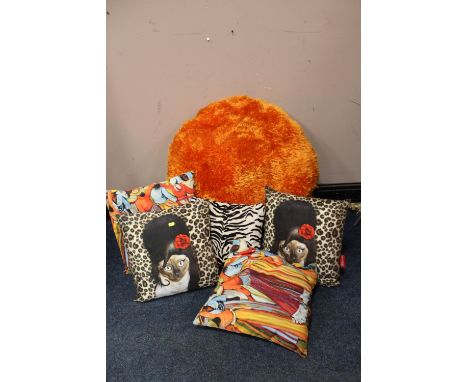 A COLLECTION OF FIVE MODERN CUSHIONS TO INCLUDE 'PETSROCK' TOGETHER WITH A RETRO STYLE ORANGE POUFFE