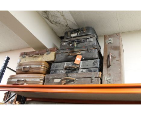 A COLLECTION OF NINE ASSORTED VINTAGE SUITCASES, largest 65 x 51 cm