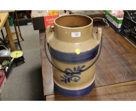 A DECORATIVE CERAMIC CHURN 