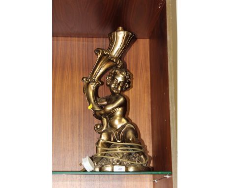 A LARGE MODERN CHALK TABLE LAMP IN THE FORM OF A CHILD HOLDING A CORNUCOPIA