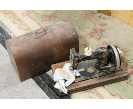 A CASED VINTAGE GERMAN MADE HAND PAINTED SEWING MACHINE