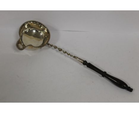 AN ANTIQUE TODDY LADLE 