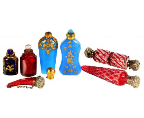 SEVEN ENGLISH AND FRENCH GLASS SCENT BOTTLES, 19TH C  including two giltmetal mounted opaline examples and a silver capped, r