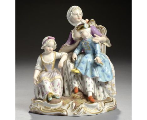 A  MEISSEN GROUP OF A MOTHER AND TWO CHILDREN, C1870  18cm h, incised 2374, crossed swords ++Thumb and object held in boy's l