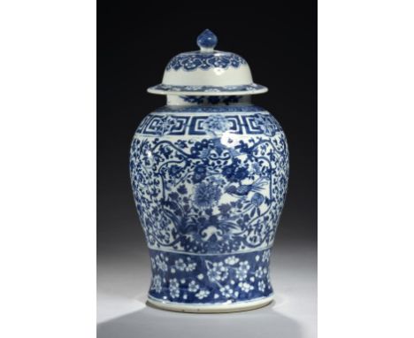 A CHINESE BLUE AND WHITE JAR AND COVER, QING DYNASTY, 19TH C  painted with birds in boughs on a band of classic scroll, 38cm 