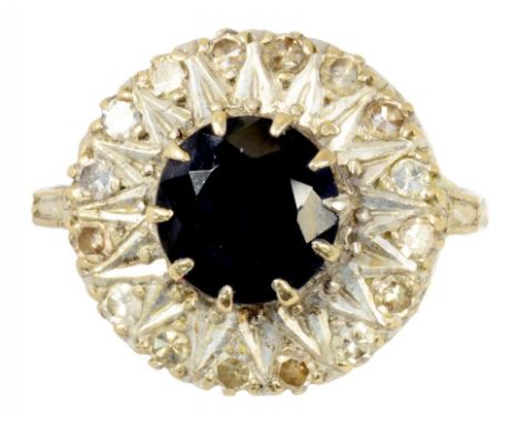 A SAPPHIRE AND DIAMOND CLUSTER RING  in gold, marked 18ct, 6.7g, size K½ ++Satisfactory second hand condition