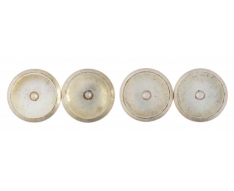 A PAIR OF CULTURED PEARL, MOTHER OF PEARL, PLATINUM AND GOLD CUFFLINKS 1.3cm diam, marked 18ct Platinum, 5.6g ++Both in satis