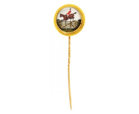 A VICTORIAN GOLD STICKPIN SET WITH A REVERSE PAINTED INTAGLIO CRYSTAL OF A FOX HUNTER   terminal 2.3cm diam, 8.6g ++Pin sligh