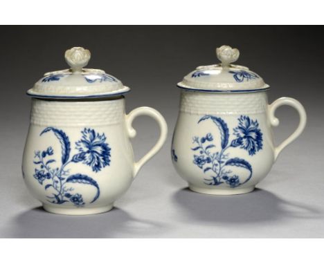 TWO WORCESTER BLUE AND WHITE OSIER MOULDED CUSTARD CUPS AND COVERS, C1780 with the Gillyflower print, 8.5cm h, hatched cresce