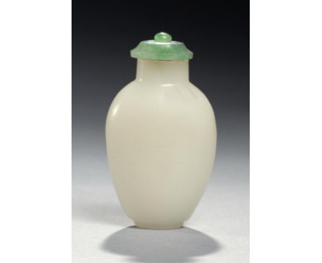 A CHINESE CELADON JADE SNUFF  BOTTLE AND A JADEITE STOPPER, 19TH/20TH C 6.5cm h ++Chip on neck of bottle, stopper lacking sco