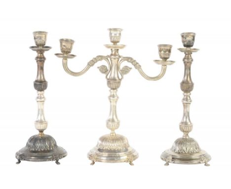 AN EGYPTIAN SILVER GARNITURE, MID 20TH C of twin branch candelabrum and pair of candlesticks, on paw feet, candelabrum 20cm h