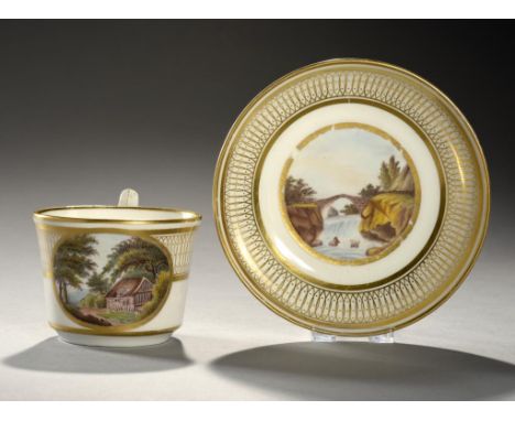 A DERBY TEACUP AND SAUCER, C1805 painted with a central landscape and gilt, saucer 14cm diam, painted mark and title In the G
