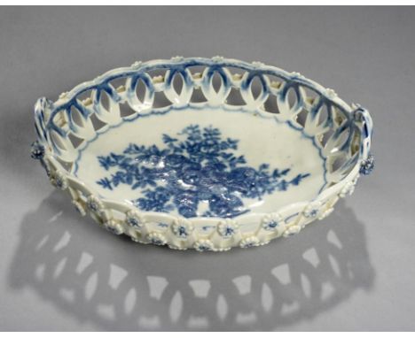 A WORCESTER BLUE AND WHITE RETICULATED OVAL BASKET, C1780  transfer printed with the Pine Cone Group, 20.5cm w, hatched cresc