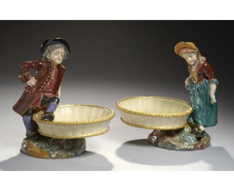 A PAIR OF ROYAL WORCESTER BOY AND GIRL 'HOGARTH' COMPORTS DESIGNED BY JAMES HADLEY, 1886 20cm h, impressed and printed marks 