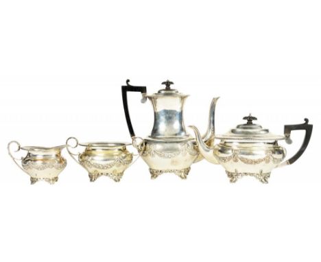 A VICTORIAN SILVER COMPOSED TEA AND COFFEE SERVICE  integral hinge to the pots, coffee pot 23cm h, by H Matthews and J Rodger