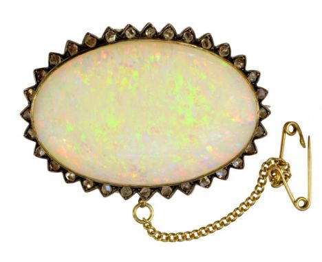 AN OVAL OPAL AND ROSE DIAMOND BROOCH, EARLY 20TH C  3.1 x 4.3cm, 12.8g ++Good condition, opal undamaged and not scratched or 