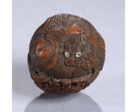 A BOXWOOD NETSUKE OF PRINCE YAMATO TAKERU SLAYING A SERPENT MONSTER, MEIJI PERIOD 3.3cm diam, engraved Seimin on a mother of 