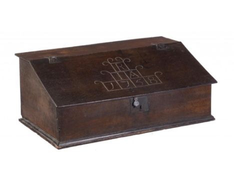 A BOARDED OAK DESK BOX, DATED 1758  the flap carved with the initials R/I*A1758, having fitted interior, iron hasp lockplate 