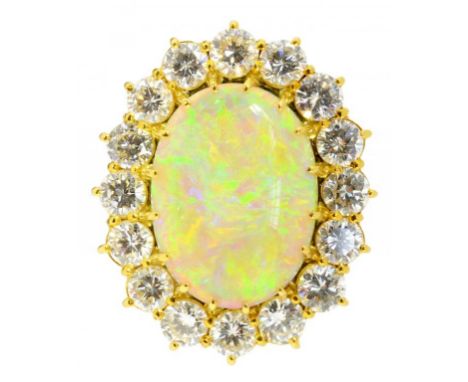 AN OPAL AND DIAMOND CLUSTER RING  the 1.3 x 1.8cm oval opal in brilliant cut diamond surround, in gold, indistinctly marked, 