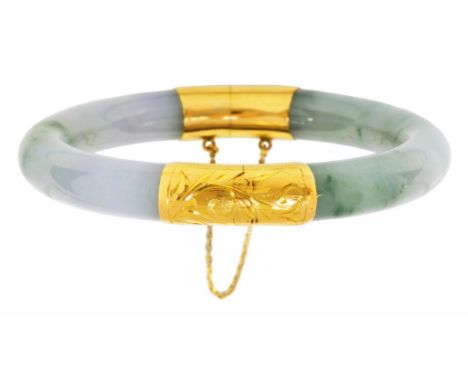 A SOUTH EAST ASIAN GOLD MOUNTED JADE BRACELET  7.5cm, marked 14K 585, 52g ++In satisfactory second hand condition