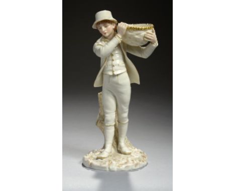 A ROYAL WORCESTER GLAZED PARIAN FIGURAL SPILL HOLDER OF A BOY CARRYING A BASKET DESIGNED BY JAMES HADLEY IN THE MANNER OF KAT