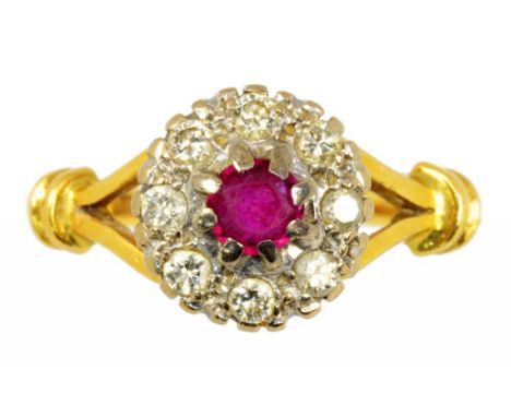 A RUBY AND DIAMOND CLUSTER RING  in 18ct gold, London 1976, 4.6g, size P ++In satisfactory second hand condition