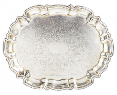 AN INDIAN SILVER SALVER, MID 20TH C with moulded border, on leafy feet, 36.5cm w, unmarked, 24ozs  Provenance: Ratan Kumar Ne