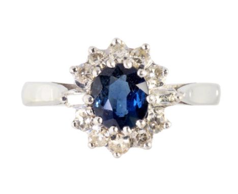 A SAPPHIRE AND DIAMOND CLUSTER RING  in white gold, marked 18ct, 3.5g, size K ++Satisfactory second hand condition